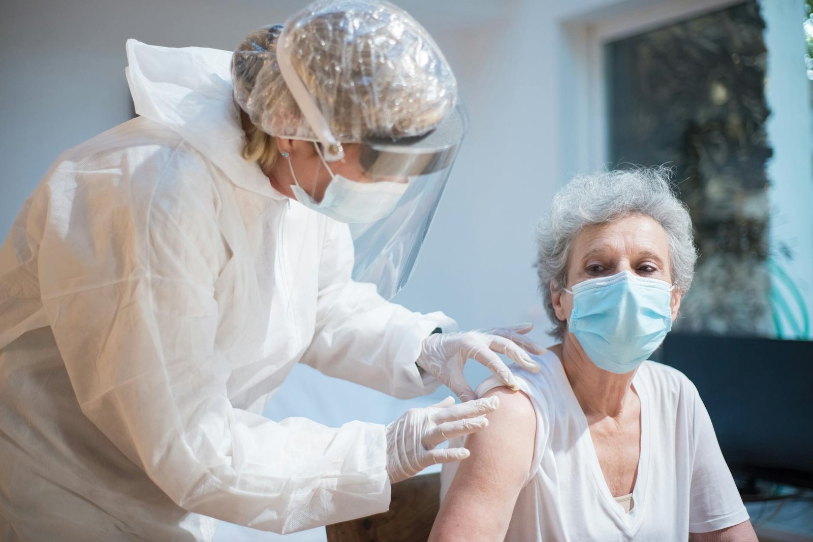 Healthcare worker supporting a senior patient with wellness